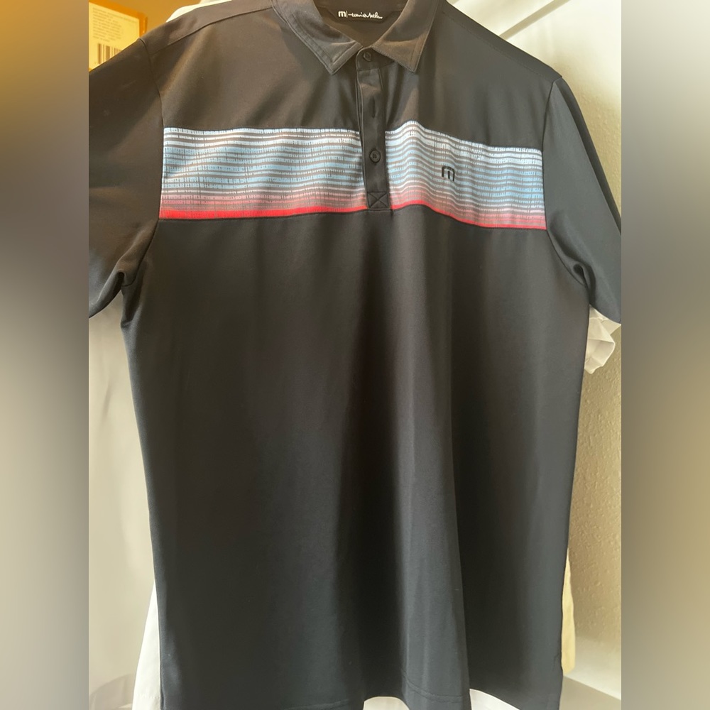 Travis Mathew’s polo. Black multi color like new